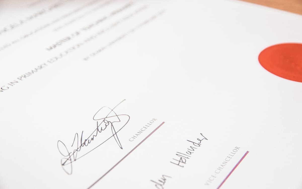 A signed certificate with a red seal